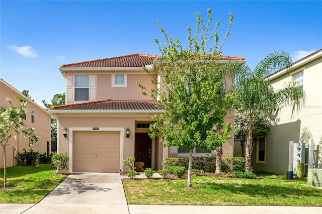 mediterranean / spanish-style home featuring a garage and a front lawn