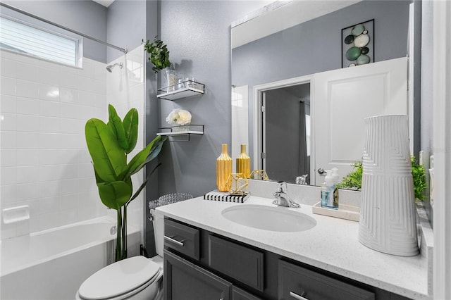 full bathroom with vanity, washtub / shower combination, and toilet