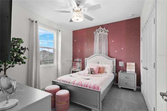 bedroom with dark carpet and ceiling fan