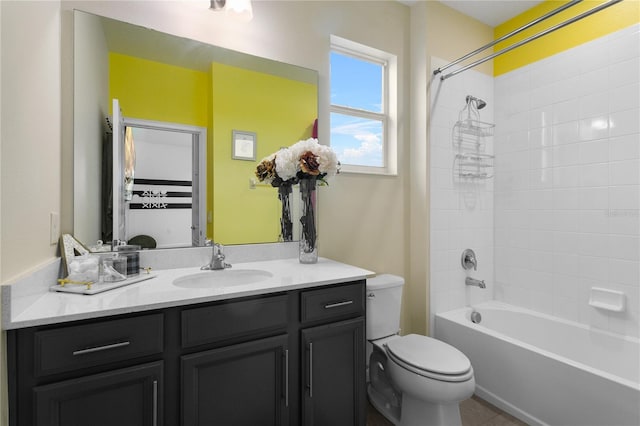 full bathroom featuring vanity, toilet, tile patterned flooring, and tiled shower / bath combo