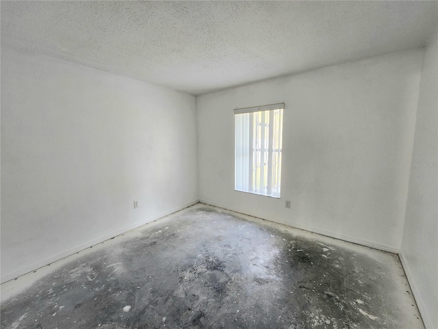 empty room featuring a textured ceiling