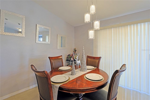 dining room featuring lofted ceiling