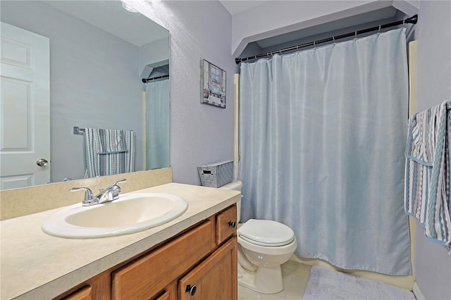 bathroom featuring tile patterned floors, vanity, toilet, and a shower with curtain