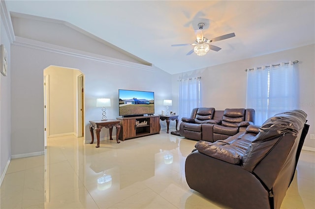 living room featuring ceiling fan, a healthy amount of sunlight, and vaulted ceiling