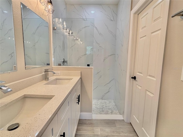 bathroom featuring vanity and a tile shower