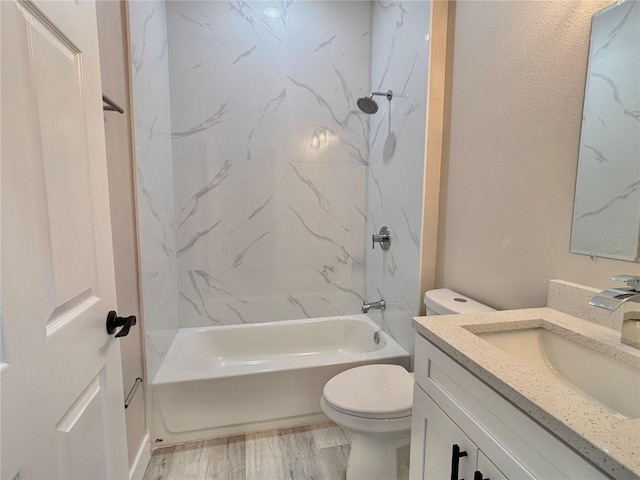 full bathroom with shower / bathing tub combination, vanity, toilet, and hardwood / wood-style floors