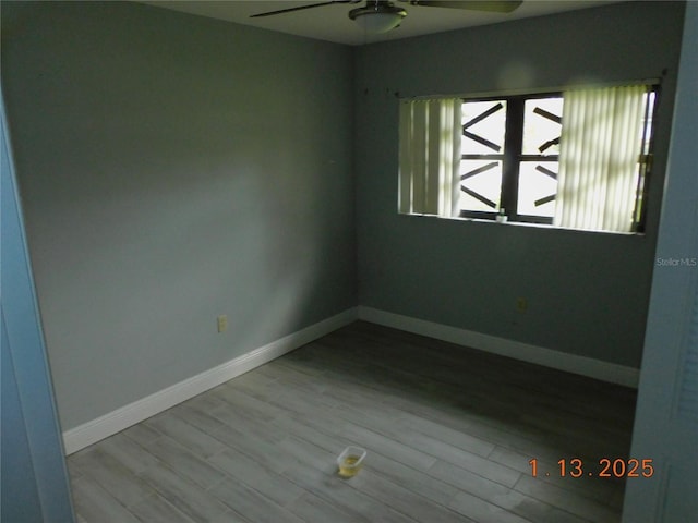 spare room featuring ceiling fan and light wood-type flooring