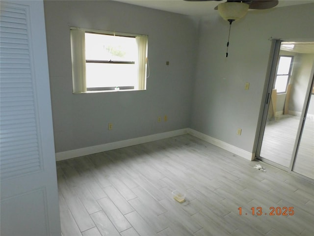 spare room with ceiling fan and light hardwood / wood-style flooring