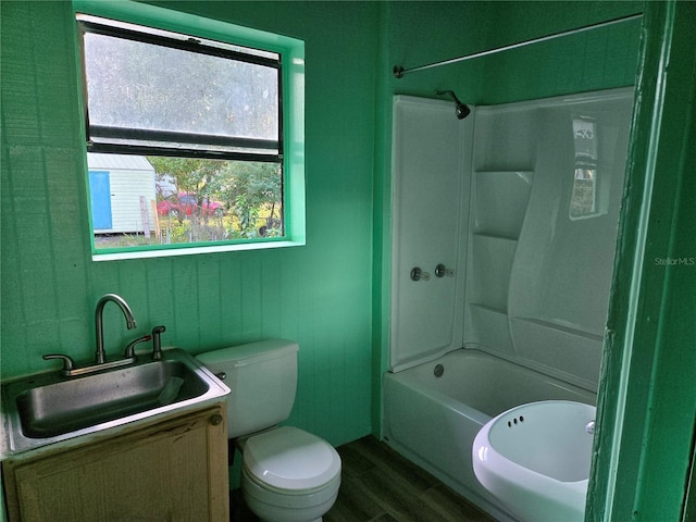 full bathroom featuring shower / tub combination, toilet, vanity, and hardwood / wood-style flooring