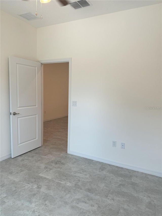 spare room with ceiling fan