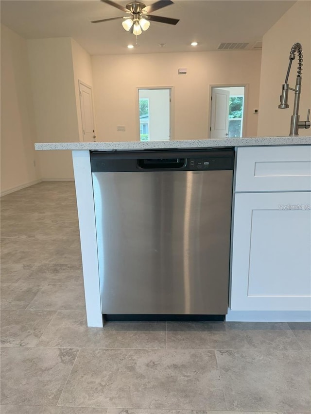 kitchen with white cabinets, stainless steel dishwasher, and ceiling fan