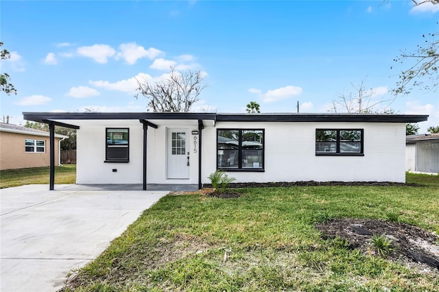 single story home with a carport and a front yard