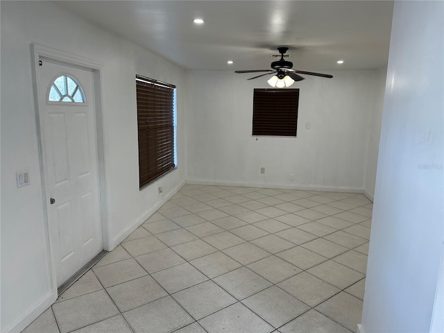 tiled entrance foyer featuring ceiling fan