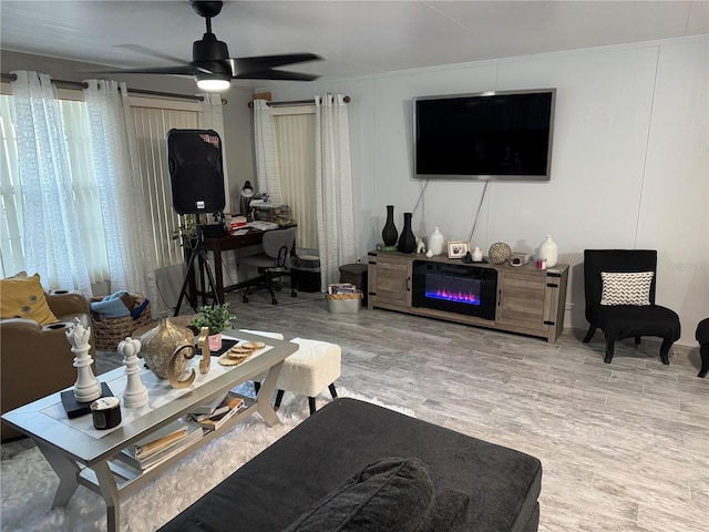 living room featuring ceiling fan and wood-type flooring