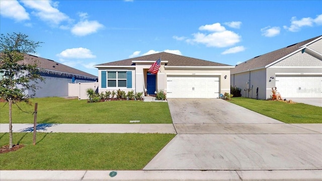 ranch-style house with a garage and a front lawn