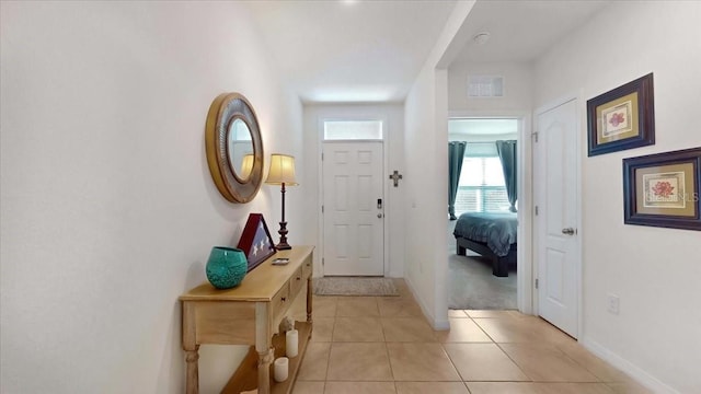 doorway featuring light tile patterned floors