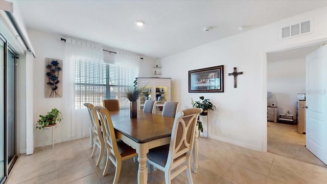 dining space with light tile patterned floors