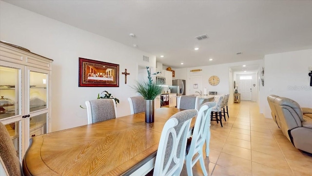 dining space with light tile patterned flooring