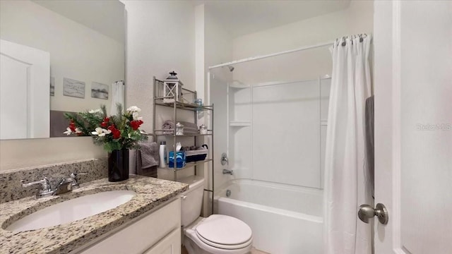 full bathroom with vanity, toilet, and shower / bath combo with shower curtain