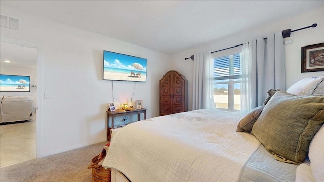 bedroom featuring light colored carpet