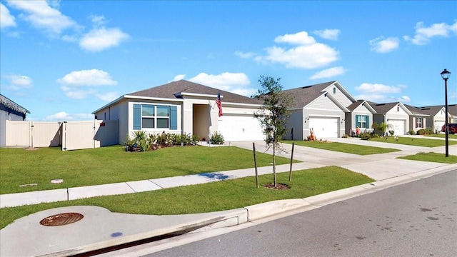 view of front of property featuring a garage and a front lawn