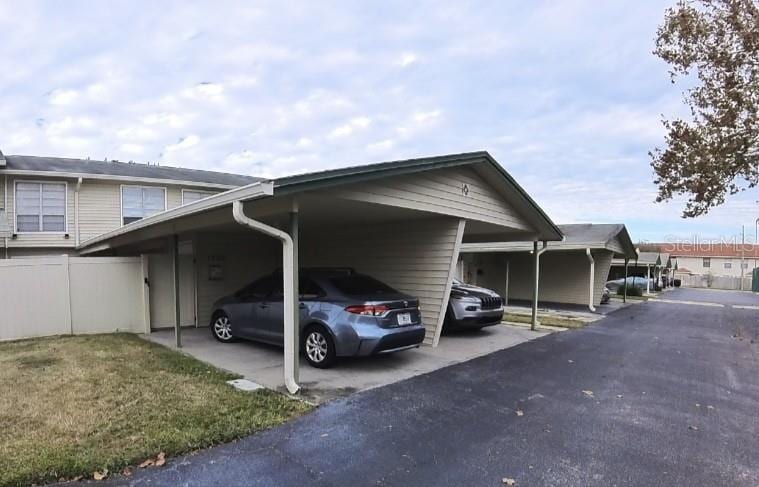 view of parking featuring a carport