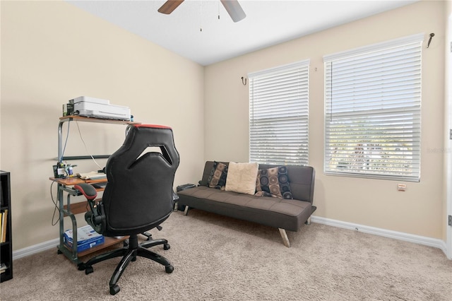 carpeted home office with ceiling fan