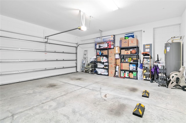 garage with a garage door opener and gas water heater