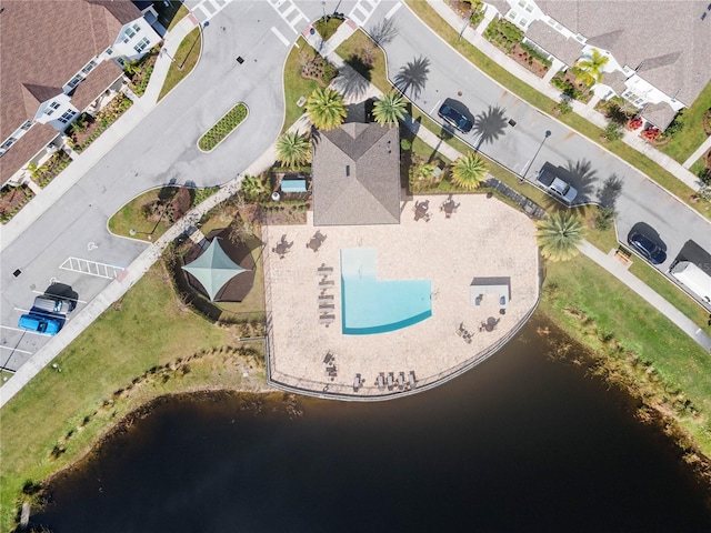 birds eye view of property featuring a water view