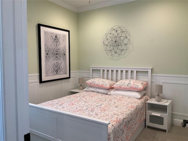 carpeted bedroom featuring ornamental molding