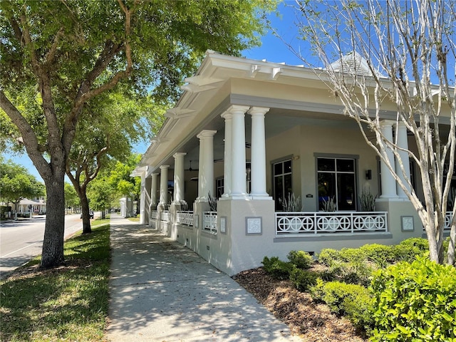 view of side of property with a porch