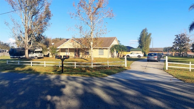 view of front of home with a front lawn