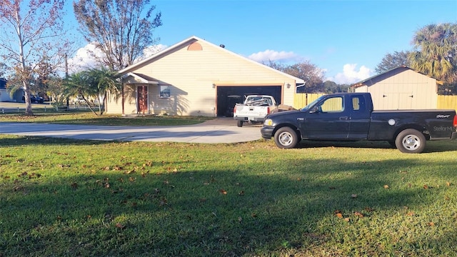 view of property exterior featuring a yard and a garage