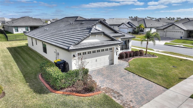 view of side of home with a yard and a garage