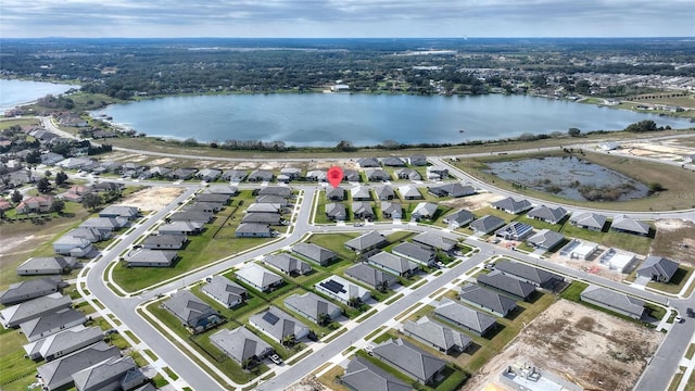 birds eye view of property featuring a water view