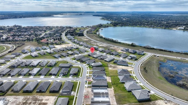 drone / aerial view featuring a water view