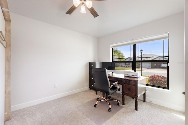 carpeted office with ceiling fan