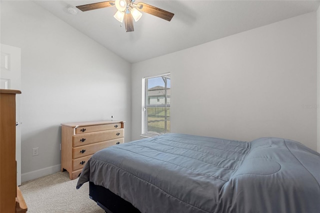 carpeted bedroom featuring ceiling fan and lofted ceiling