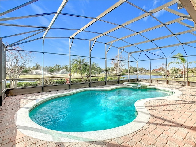 view of pool featuring a lanai, a water view, a patio, and an in ground hot tub