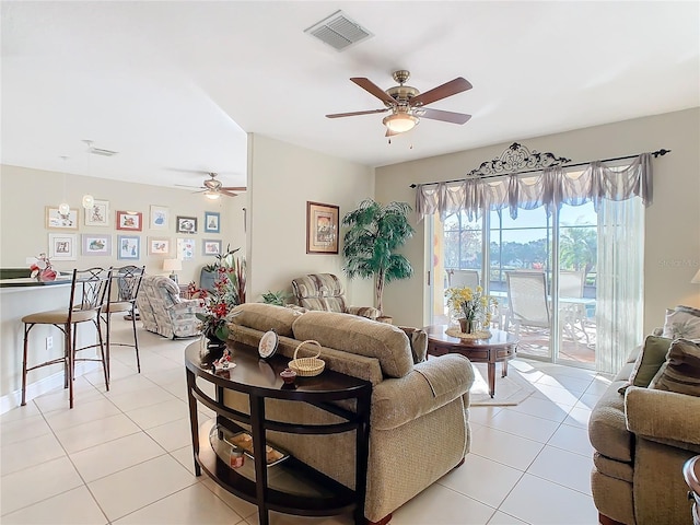 tiled living room featuring ceiling fan