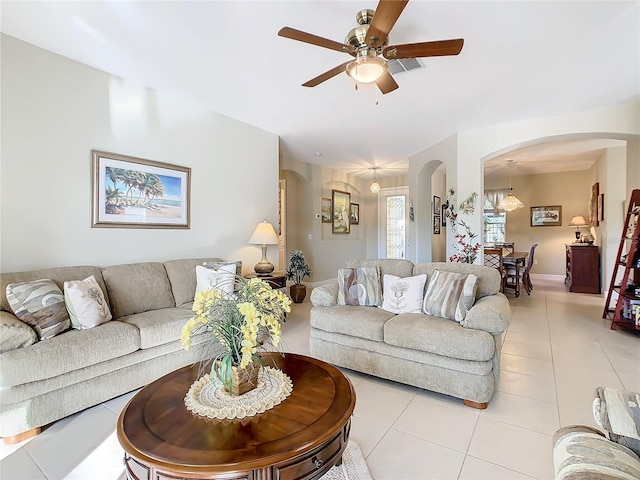 living room featuring ceiling fan and light tile patterned floors