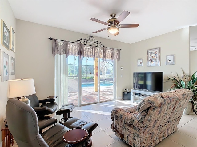 living room featuring ceiling fan and light tile patterned floors