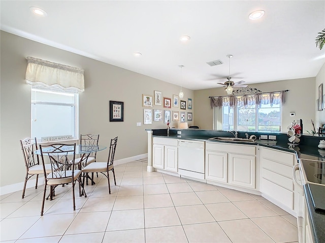 kitchen featuring white appliances, white cabinets, sink, ceiling fan, and light tile patterned floors