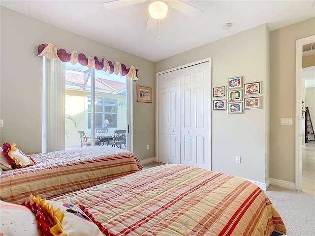 bedroom featuring ceiling fan, access to exterior, carpet floors, and a closet