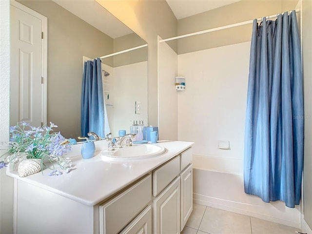 bathroom featuring vanity, tile patterned flooring, and shower / bath combo