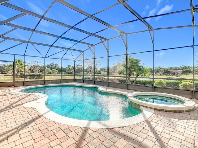 view of swimming pool featuring glass enclosure, a patio area, and an in ground hot tub