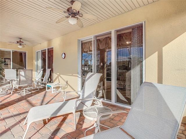 view of patio featuring ceiling fan