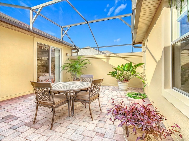 view of patio / terrace with glass enclosure