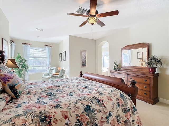 bedroom with ceiling fan and light colored carpet