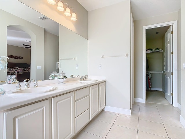 bathroom featuring ceiling fan, vanity, and tile patterned flooring